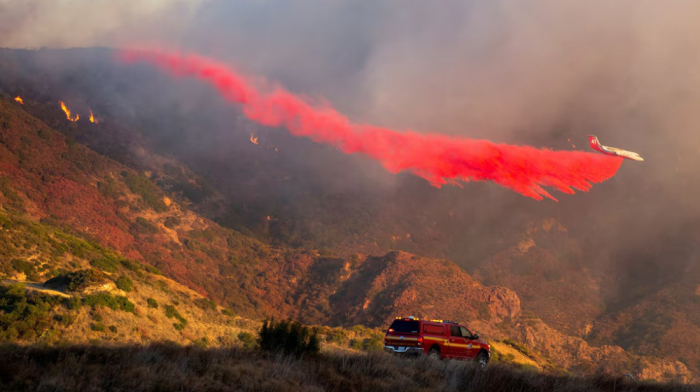 Wildfire forces evacuations in Malibu as winds spread flames
