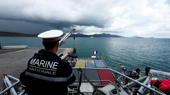 Macron arrives in cyclone-battered Mayotte as heavy rains hit islands