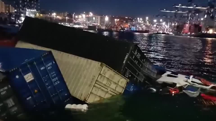 Cargo ship rolls over on its side at Istanbul Port