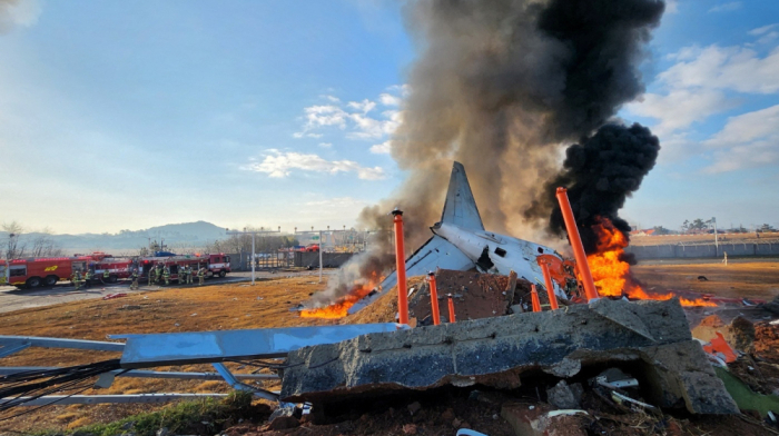 At least 120 dead in fiery South Korea airliner crash, two crew rescued