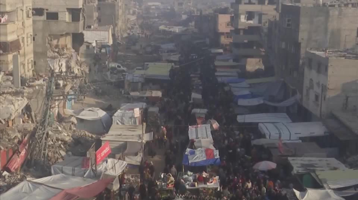 Shoppers in Khan Younis marketplace as Israel cabinet prepares to approve ceasefire deal