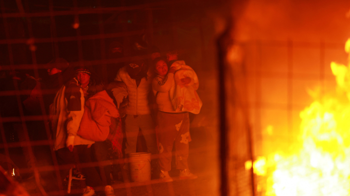 Migrants set fire in midnight camp raid in northern Mexico