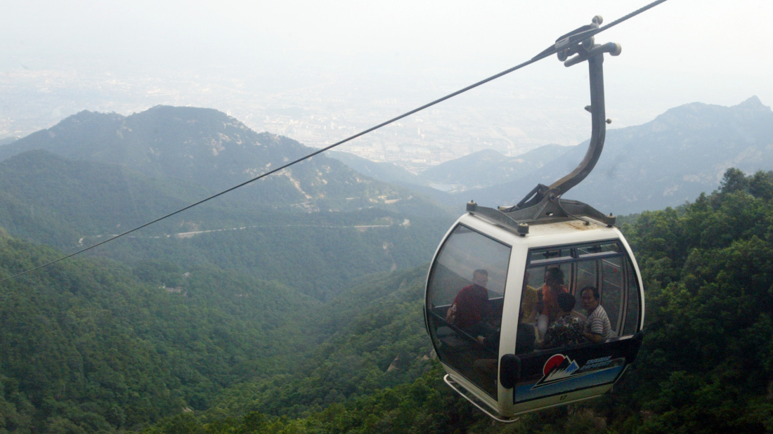 Robotic exoskeletons help Chinese tourists climb the country’s most punishing mountain
