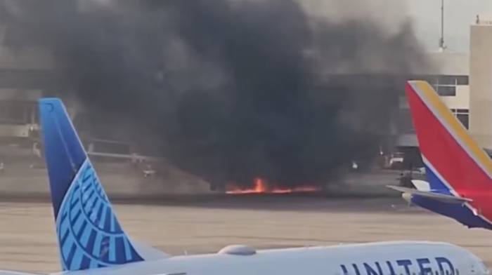 American Airlines plane catches fire after landing in Denver