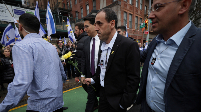 Former Israeli hostage Eli Sharabi greets supporters outside United Nations in New York