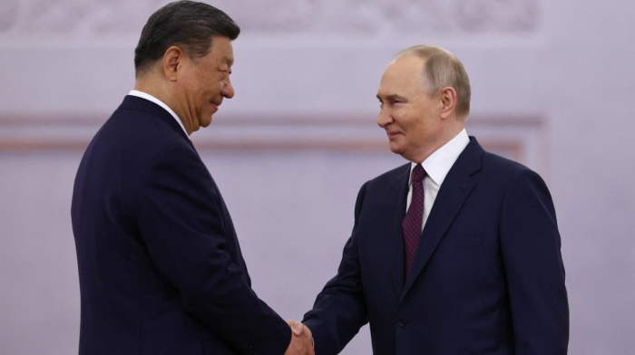 Putin and Xi meet in Moscow to bolster partnership