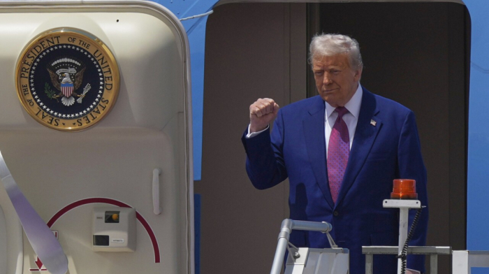 Trump arrives in Qatar after ending Syria sanctions, meeting formerly wanted Syrian president