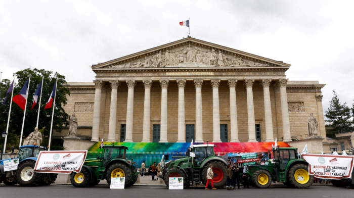 French farmers drive tractors to parliament, demand looser environmental rules