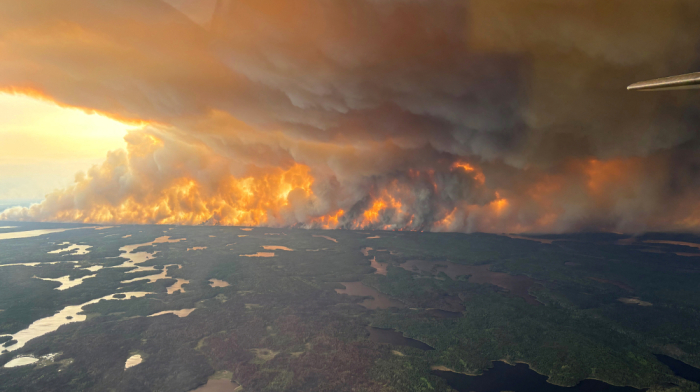 Manitoba orders mass evacuation as wildfires sweep central and western Canada