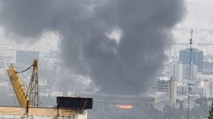 Strike hits Iranian state broadcaster headquarters during live programming