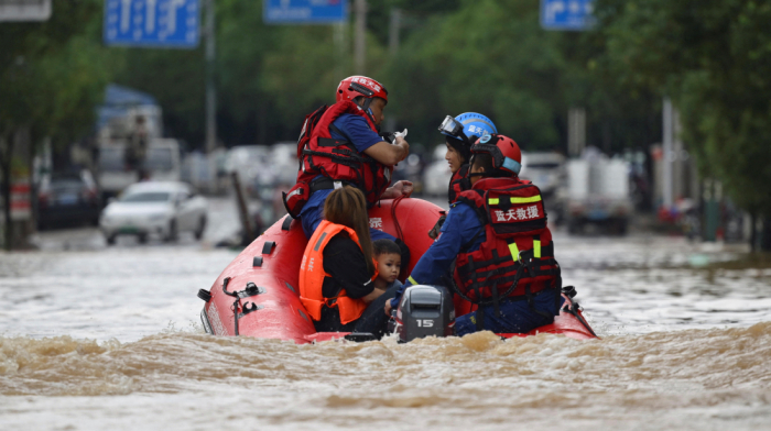 Floods hit China amid record rains and climate warnings