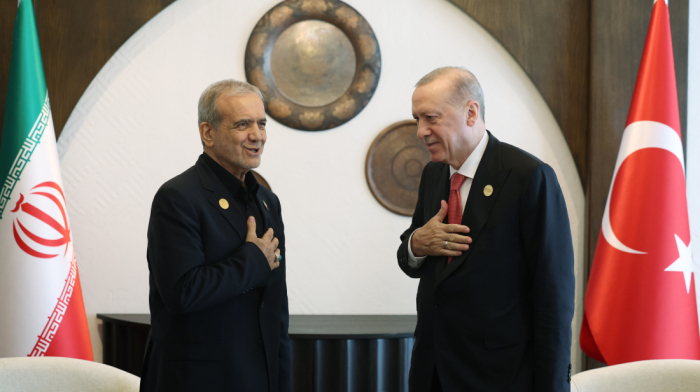 Turkish and Iranian presidents greet each other at ECO summit in Khankendi