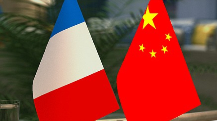 Macron and Wang Yi vow stronger trade ties and global cooperation