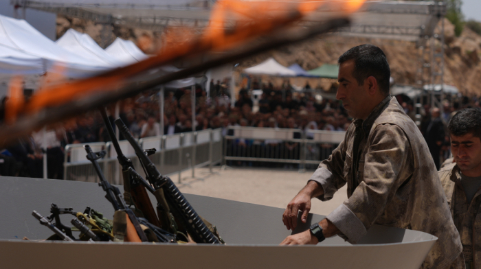 PKK fighters burn weapons in first disarmament ceremony in northern Iraq