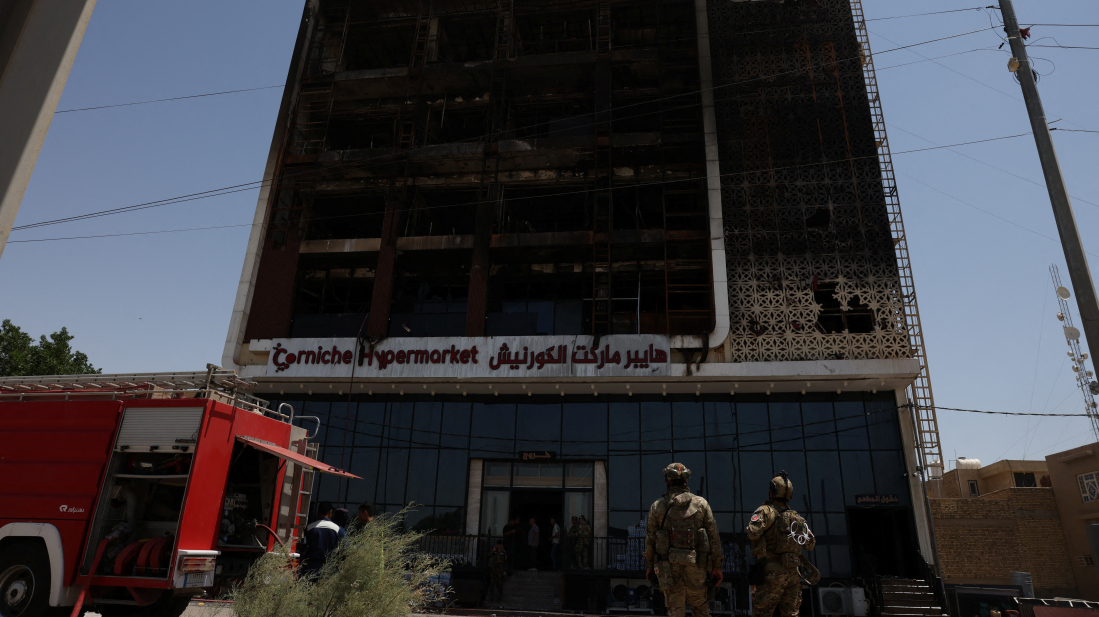 Fire at Iraq hypermarket kills at least 60 people, with several missing, in al-Kut