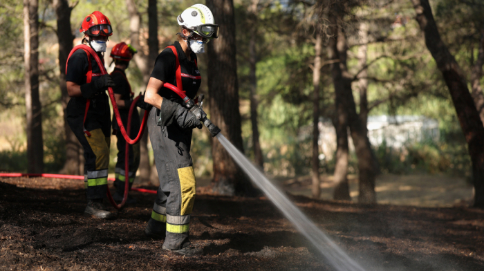 Hundreds of firefighters battling wildfire in southern France amid improved weather conditions