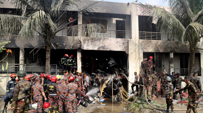 At least 19 killed as Bangladesh air force plane crashes into college campus