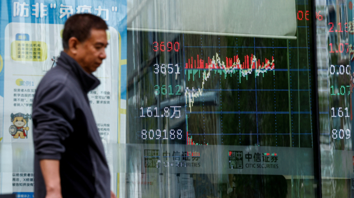 Asian stocks fall on weak China data as yen strengthens after BOJ decision