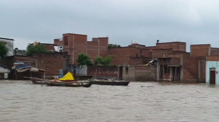 Floodwaters batter Indian towns
