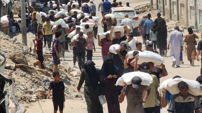 Gazans risk gunfire and long treks for single bag of flour amid deepening food crisis