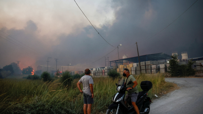 Multiple wildfires rage across Greece, forcing people to flee