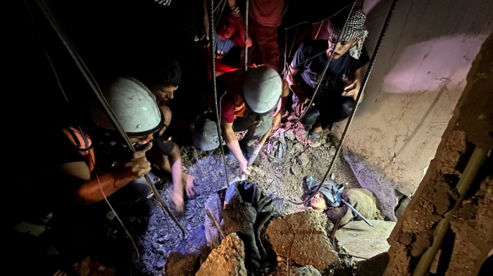 Palestinian woman rescued from rubble as Gaza hospitals struggle under Israeli airstrikes