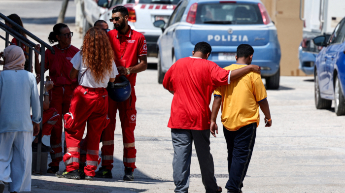 Three young sisters drown and dozens rescued from boat carrying migrants to Italy