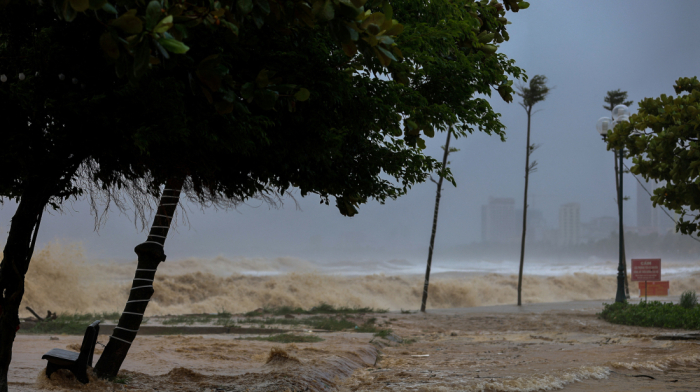 Trees down and homes flooded as Typhoon Kajiki batters Vietnam