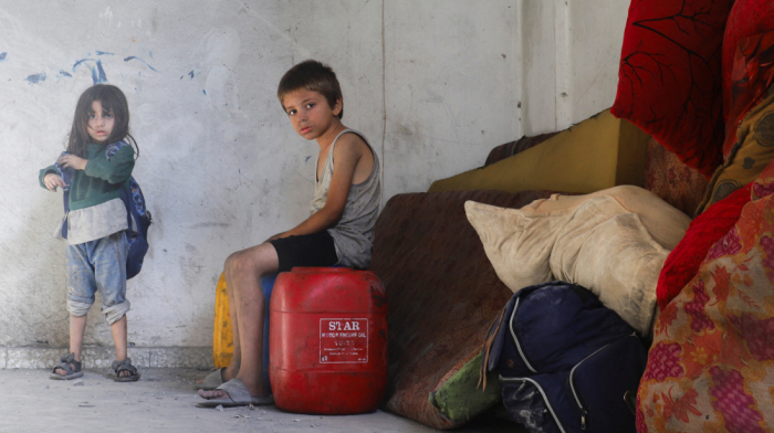 Families leave Gaza City after night of bombardment and Israelis protest