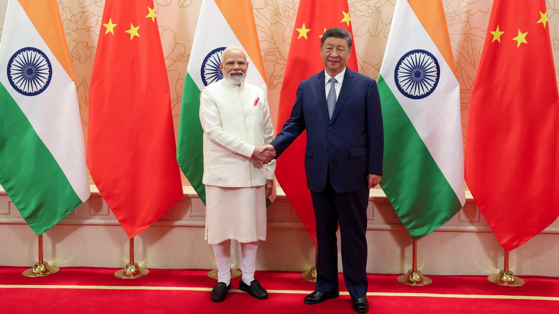 Xi and Modi pledge to ease border tensions at Tianjin summit