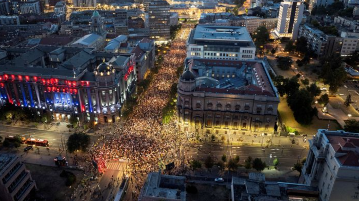 Tens of thousands march in Serbia's capital, demand snap vote