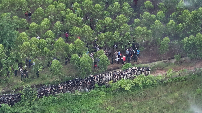 Thai police fire tear gas at Cambodian protesters at a disputed border village