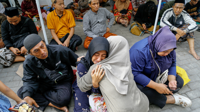 Indonesia rescuers hunt for 38 feared trapped after school collapse kills three