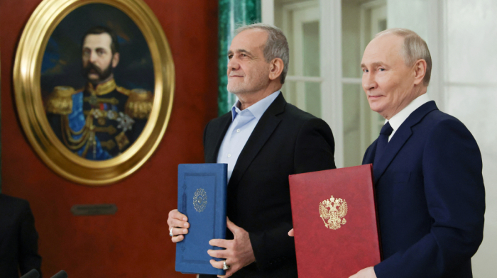 Iran flexes muscle as strategic treaty with Russia takes effect