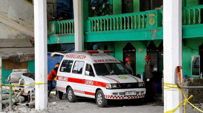 Indonesia ends search at collapsed school as death toll reaches 61