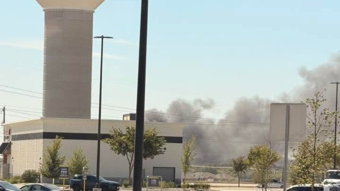 Plane crashes near Texas airport, striking trucks and trailers