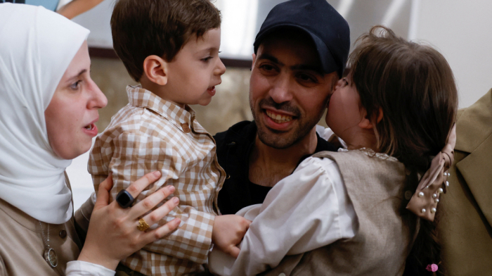 Palestinians cheer as freed prisoners begin to arrive home under ceasefire deal