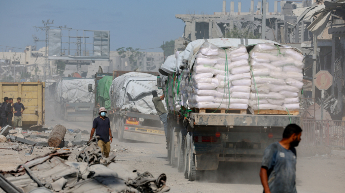Israel says one body not deceased hostage as aid trucks enter Gaza