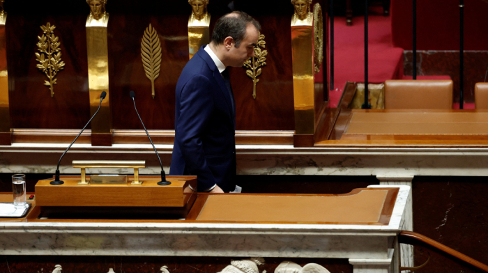 French PM survives no-confidence votes after making pension concession