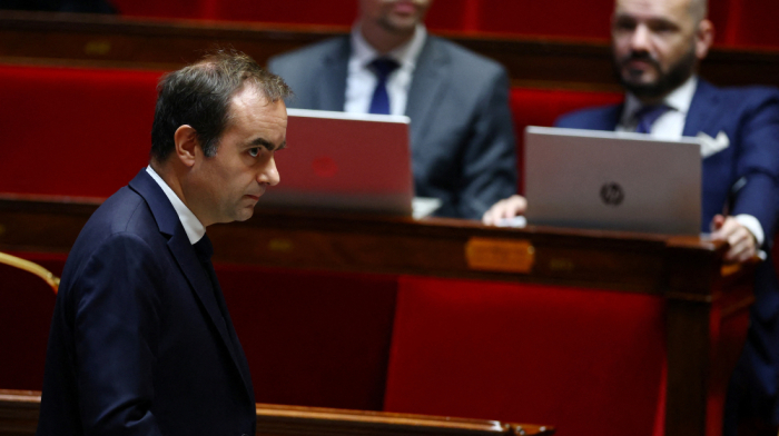 French Government faces new challenge as Socialist Party threatens no-confidence motion