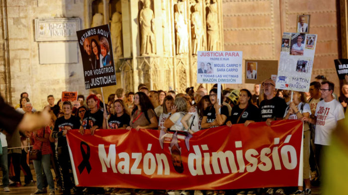 Protesters urge regional Spanish leader to quit a year after deadly floods