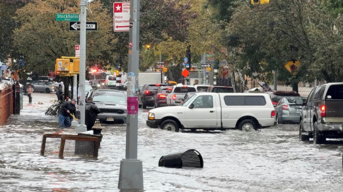 Heavy rains in New York kill two, disrupt flights