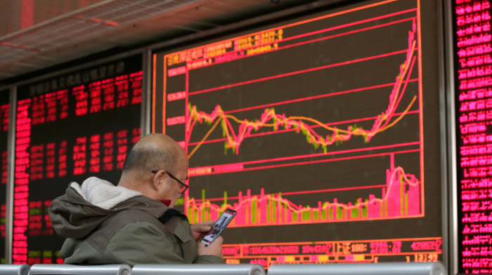 China and Hong Kong shares dip as traders await key U.S. data