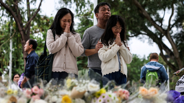 Crowds gather at site of deadly Hong Kong blaze as Beijing warns against protests