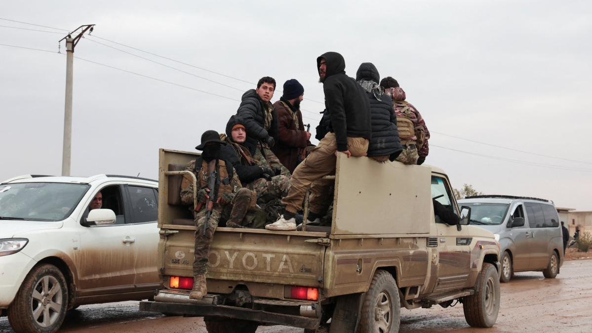 Syrian troops sweep northern towns as Kurdish fighters withdraw