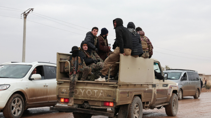 Syrian troops sweep northern towns as Kurdish fighters withdraw