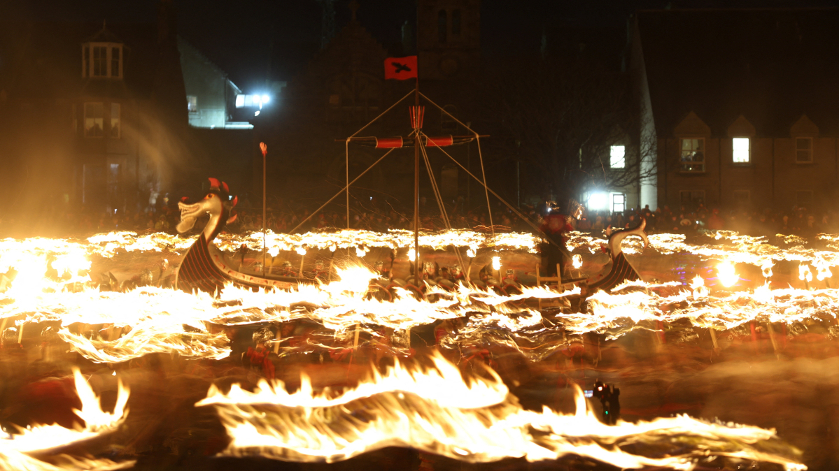 Crowds in Scotland march with torches for Europe’s largest Viking festival