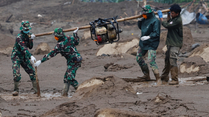 Search continues for 20 missing as Indonesia landslide death toll rises to 60