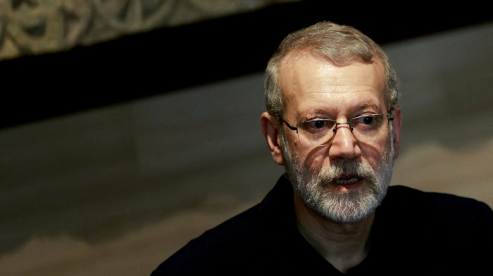 How is Iran reacting to Security Chief Ali Larijani's assassination by Israel?