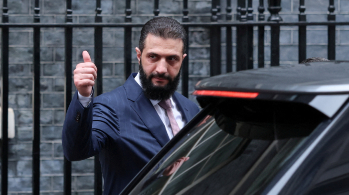 Explosions heard in Damascus as Syria's president says it will stay out of Iran conflict unless it faces aggression